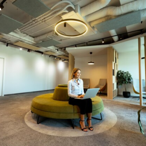 Office Interior Design showcasing a modern open-plan workspace with collaborative seating, contemporary lighting, and a productive office environment.