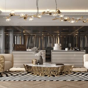 Luxury walk-in closet with gold accents, glass wardrobes, designer chandelier, and premium modern interior design.